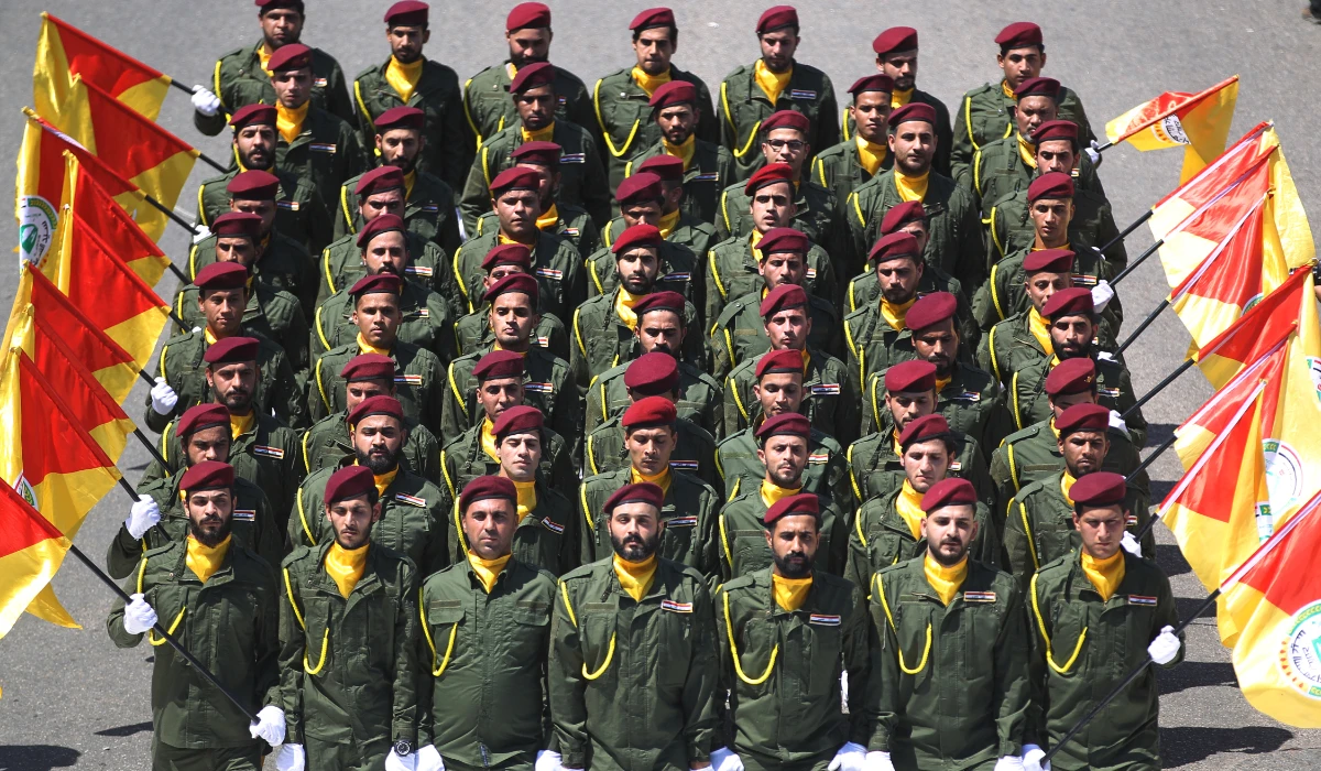 Iraqi Shiite fighters from an Iraqi armed group march during a military parade marking Al-Quds (Jerusalem) International Day in Baghdad, on May 31, 2019. (AFP)