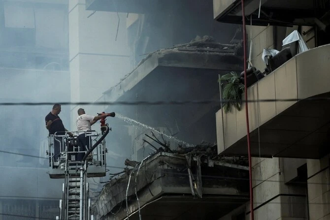 Rescuers work at a site of an Israeli strike, amid ongoing cross-border hostilities between Hezbollah and Israeli forces, in south Beirut, Lebanon. (Reuters)