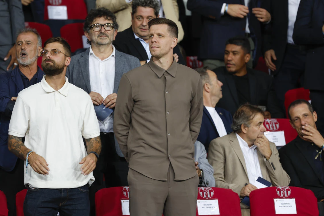 Wojciech Szczesny, center, a new goalkeeper for Barcelona is on stands during the Champions League match between Barcelona and Young Boys at the Lluis Companys Olympic Stadium in Barcelona on Oct. 1, 2024. (AP)