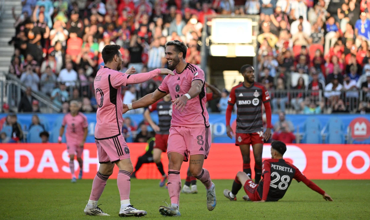 Inter Miami CF forward Leonardo Campana (8) celebrates a goal with Inter Miami CF forward Lionel Messi (10) in the second half against the Toronto FC at BMO Field. (Reuters)