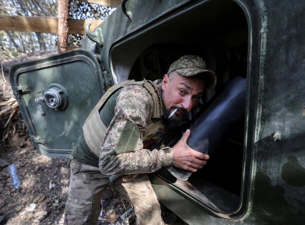 An artilleryman of the 15th Operative Purpose Brigade 'Kara-Dag' of the National Guard of Ukraine prepares to fire a 2S1 Gvozdika self-propelled howitzer towards Russian troops in a front line, amid Russia's attack on Ukraine, near the town of Pokrovsk in Donetsk region, Ukraine, October 3, 2024. (Reuters)