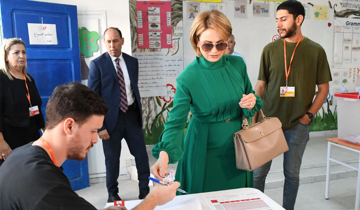 This handout picture released by Tunisia's Presidency shows Tunisia's First Lady Ichraf Saied registering to vote at a polling station during the 2024 presidential elections in Tunis on October 6, 2024. (AFP)