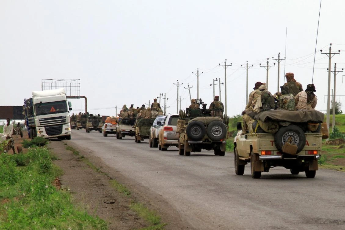 Fighters ride in vehicles moving in a military convoy accompanying the governor of Sudan's Darfur State during a stopover in the eastern city of Gedaref while on the way to Port Sudan on August 30, 2023. (FILE/AFP)