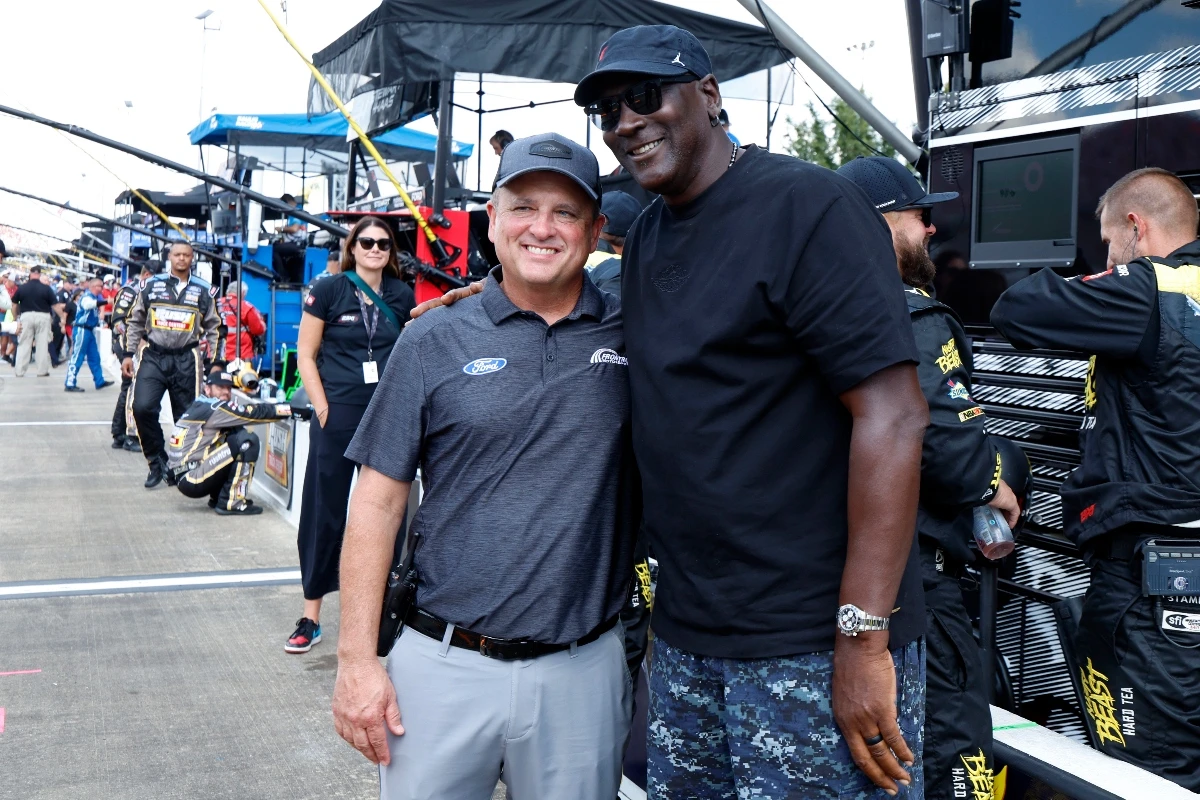 Bob Jenkins, owner of Front Row Motorsports and co-owner Michael Jordan, of 23XI Racing, pose before a NASCAR Cup Series auto race at Talladega Superspeedway Sunday in Talladega, Ala. (AP)