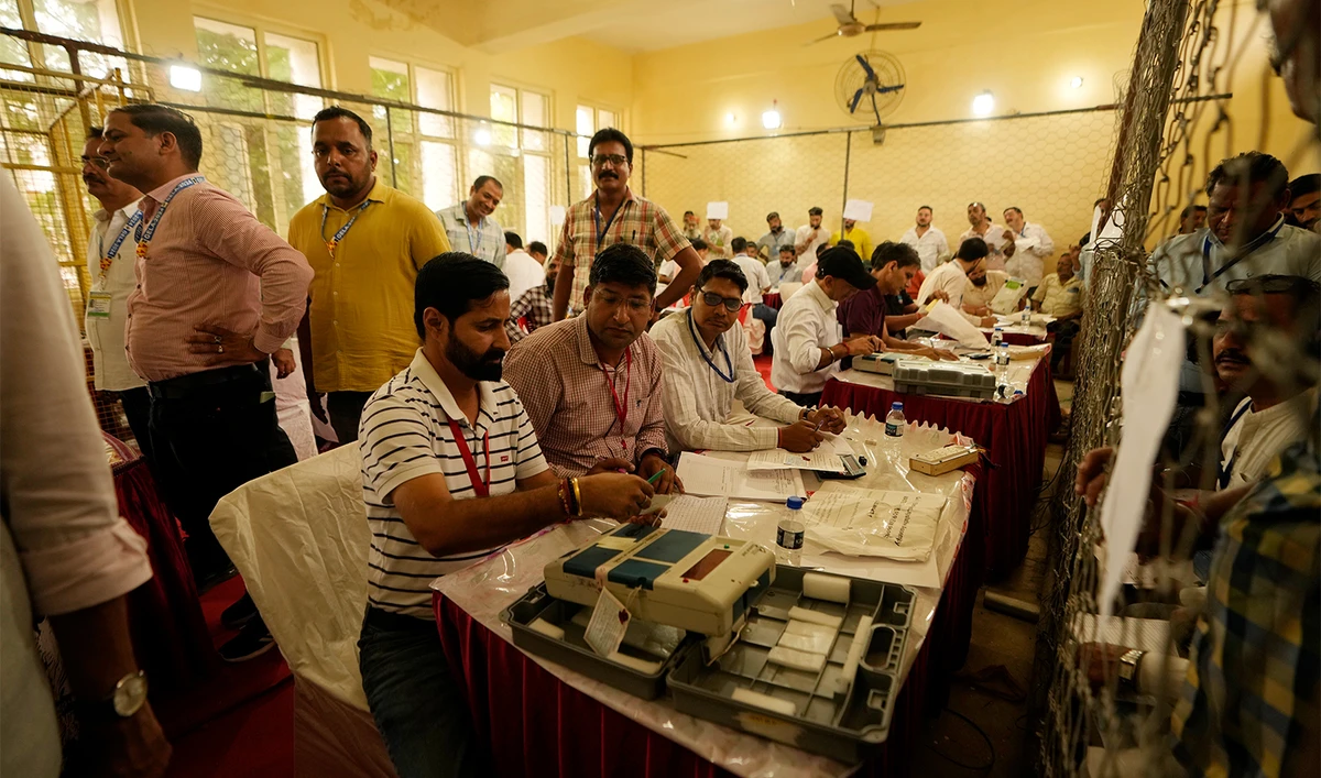 Election officers count votes for the recent election at a counting center in Jammu, India, on October 8, 2024. (AP)