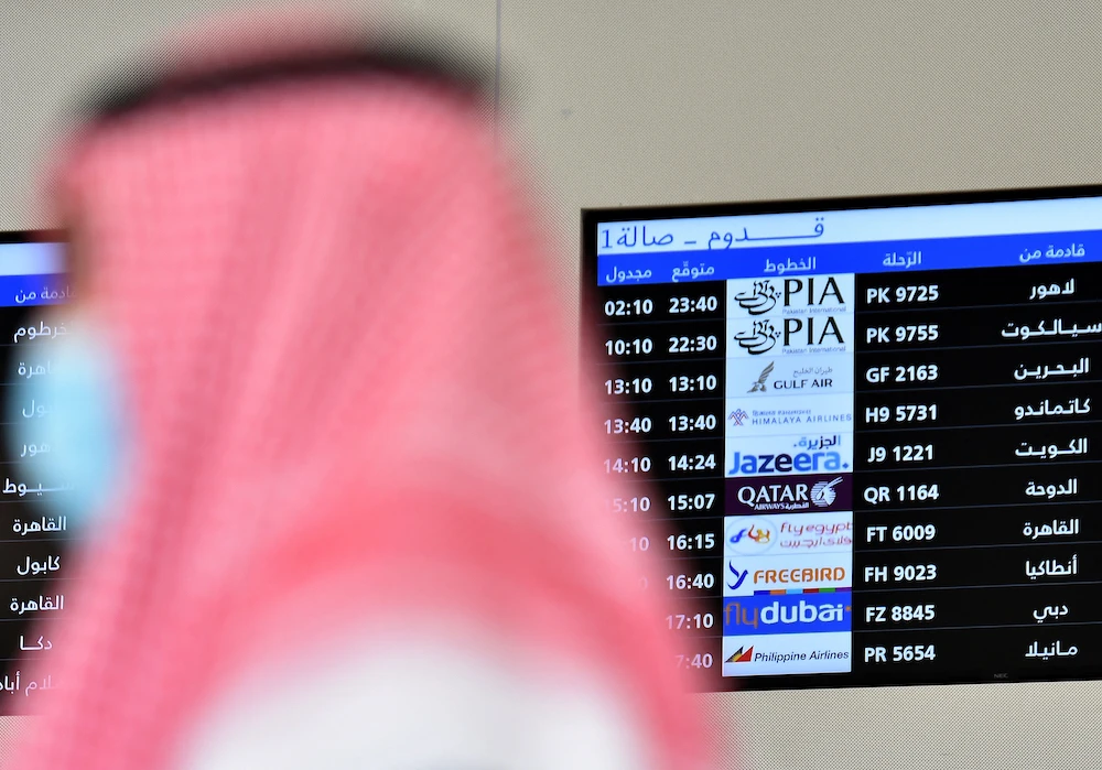 Above, an arrivals board at King Khalid International Airport in Riyadh. The General Authority of Civil Aviation issued SR150,000 in fines to airlines for non-compliance with the Civil Aviation Law and authority instruction. (AFP file photo)