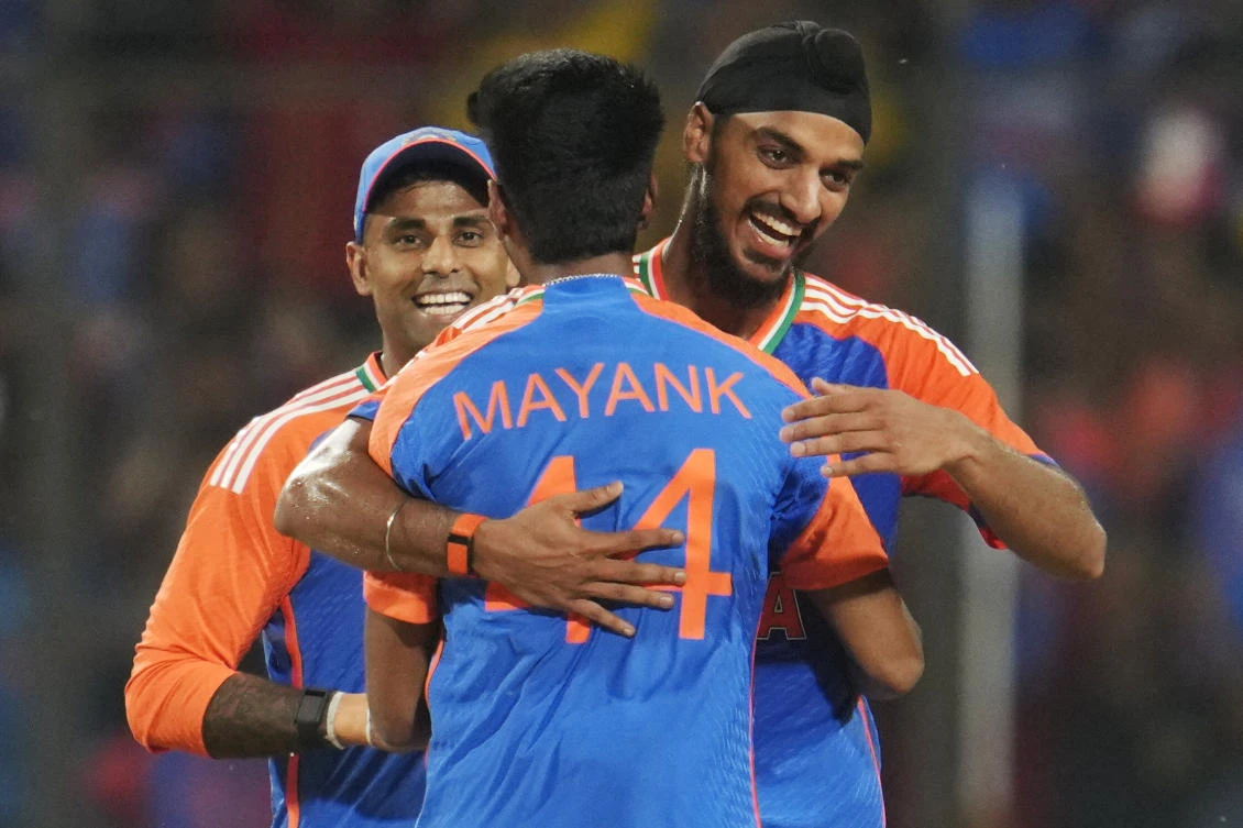 India’s Mayank Yadav, back to the camera, is congratulated by teammates Arshdeep Singh, right, and captain Suryakumar Yadav as he celebrates the wicket of Bangladesh’s Mahmudullah during the first T20 cricket match between Bangladesh and India in Gwalior, India, on Oct. 6, 2024. (AP)