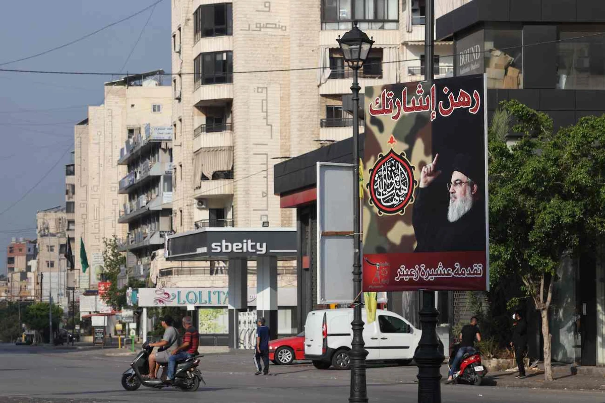 A billboard bears a picture of slain Hezbollah leader Hassan Nasrallah in the Lailaki neighbourhood of Beirut's southern suburbs on October 6, 2024. (AFP)