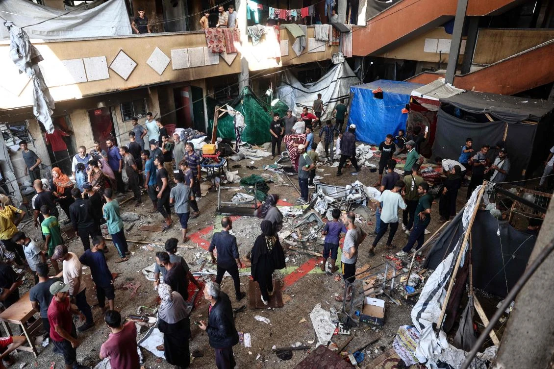 Palestinians react after an Israeli strike hit the Rafida school housing displaced people in Deir Al-Balah in the central Gaza Strip, on Oct. 10, 2024, amid the ongoing war between Israel and Hamas. (AFP)