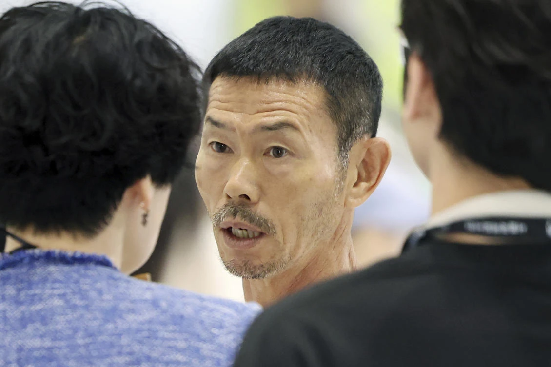 Son Woong-jung, center, father of English Premier League star Son Heung-min, waits for his book signing event in Seoul, South Korea, on Jun. 26, 2024. (AP)