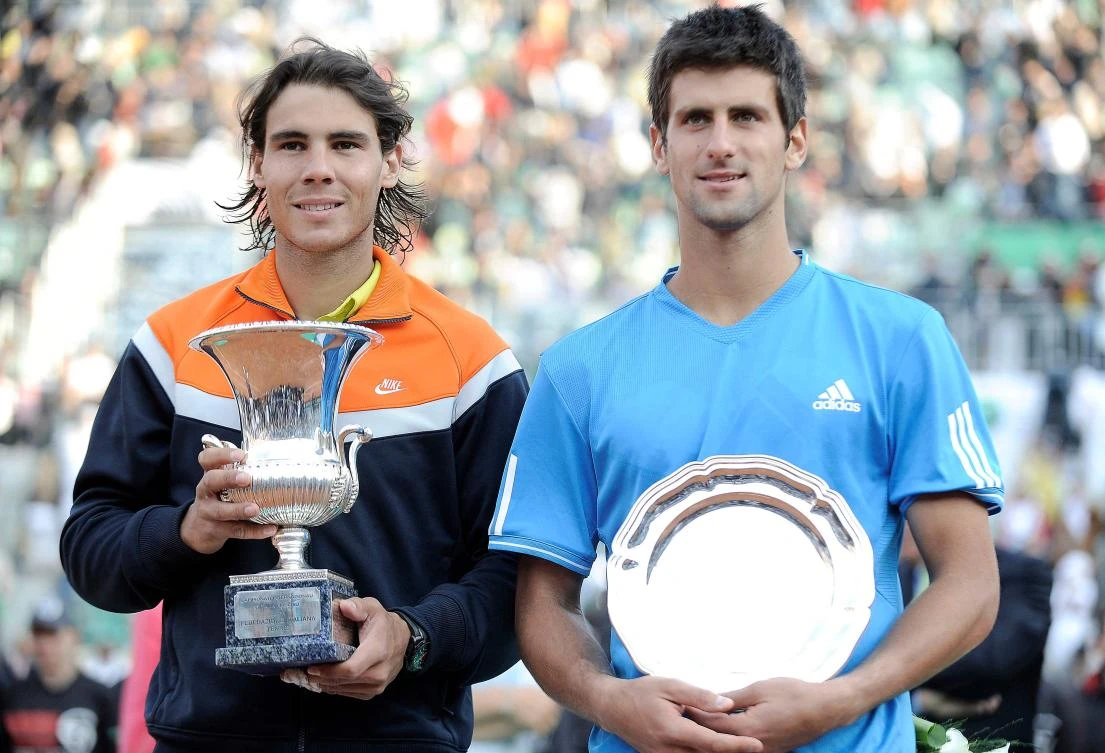 Rafael Nadal of Spain (L) and Novak Djokovic of Serbia pose with their trophies after their final match of the ATP Tennis Open match in Rome on May 3, 2009. (AFP)
