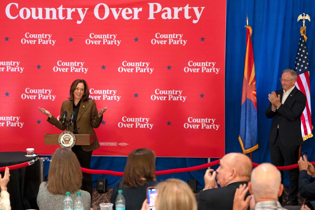US Vice President and Democratic presidential candidate Kamala Harris (L) speaks as Mesa Republican Mayor John Giles listens at a Republicans for Harris event in Scottsdale, Arizona, on October 11, 2024. (AFP)