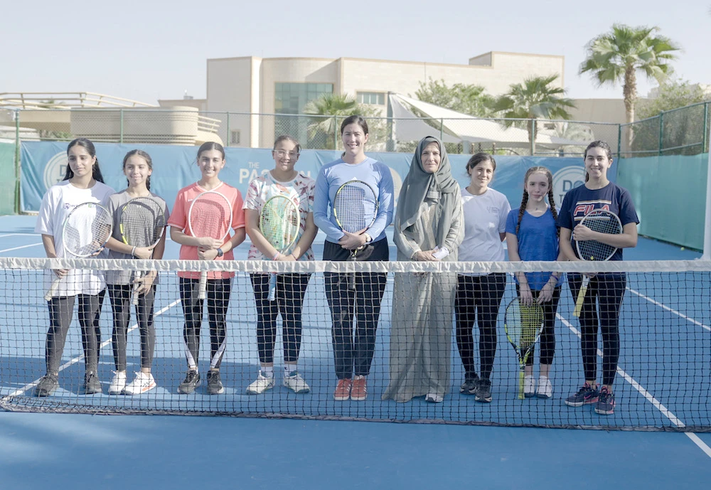WTA Finals tournament director, Garbine Muguruza (fifth left) with head of the Saudi Tennis Federation Arij Mutabagani (sixth left) during a tennis clinic in Riyadh. (Supplied)