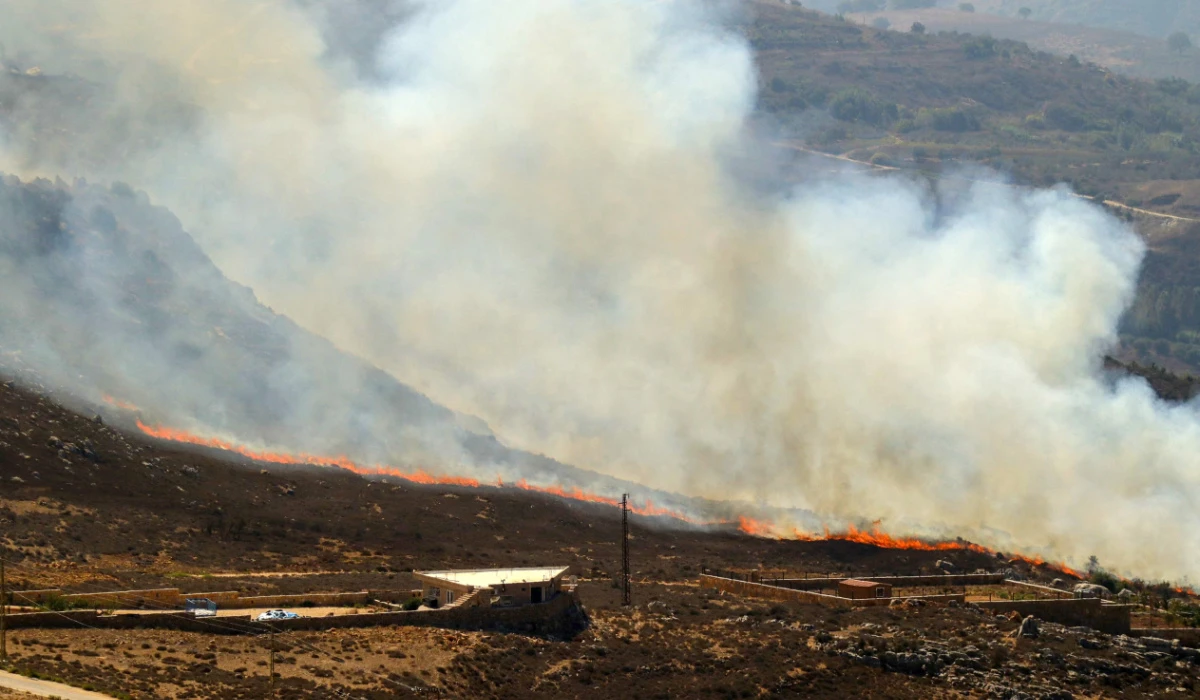 A fire rages in the southern Lebanese area of Marjeyoun along the border with Israel on October 12, 2024, amid ongoing cross-border clashes between Israeli troops and Hezbollah fighters. (AFP)