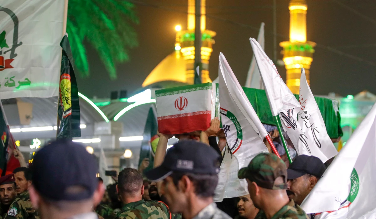 Mourners carry the coffin of Iranian Revolutionary Guards' deputy commander Brigadier Gen. Abbas Nilforushan who died alongside Hezbollah leader Hassan Nasrallah in an Israeli airstrike in Beirut last month during his funeral in Karbala, Iraq, Monday, Oct. 14, 2024. (AP)