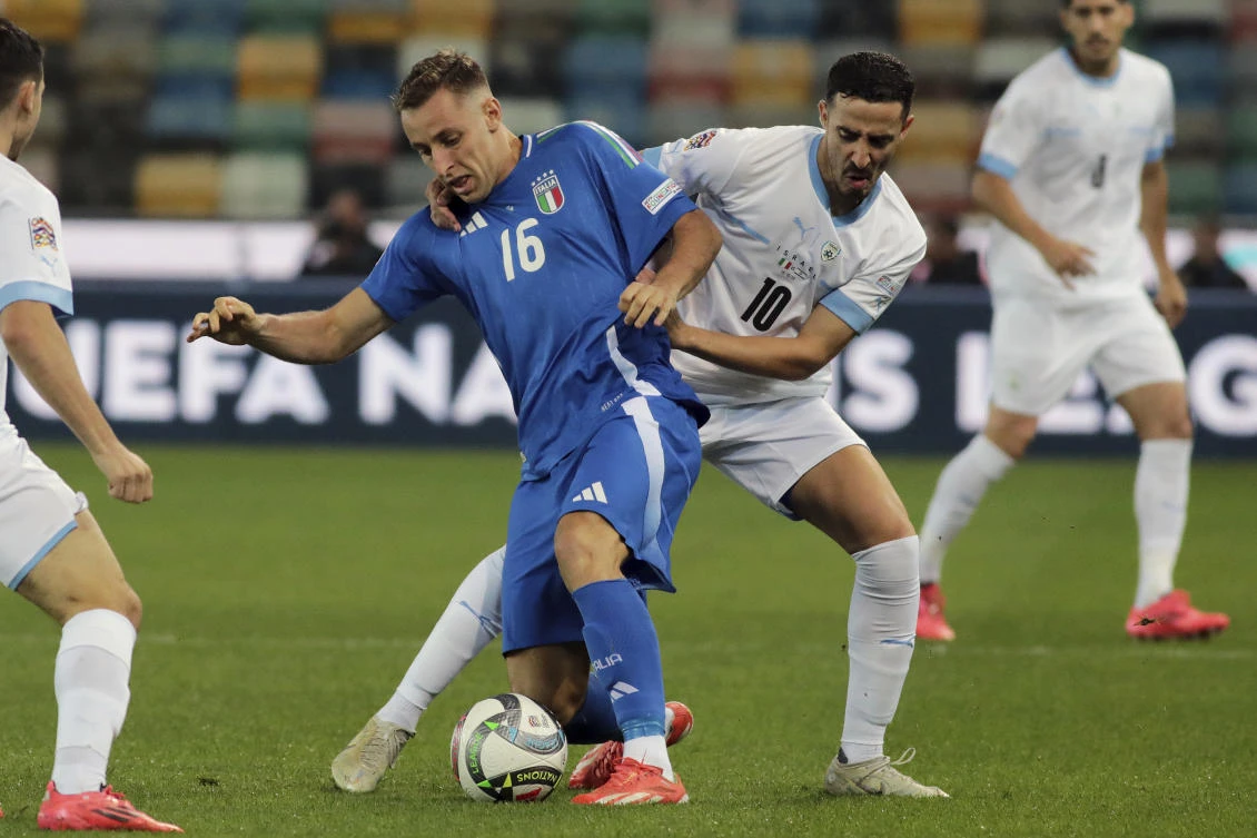 Italy’s Davide Frattesi, center left, and Israel’s Dolev Haziza challenge for the ball during their UEFA Nations League match at the Bluenergy Stadium in Udine, Italy, on Oct. 14, 2024. (AP)
