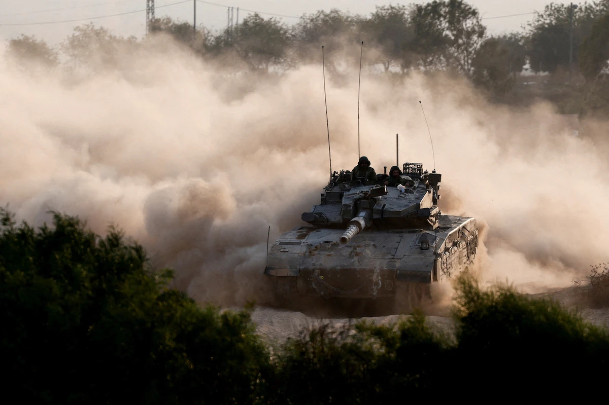 An Israeli tank manoeuvres near the Israel-Gaza border, amid the ongoing conflict between Israel and Hamas, as seen from Israel, October 15, 2024. (Reuters)