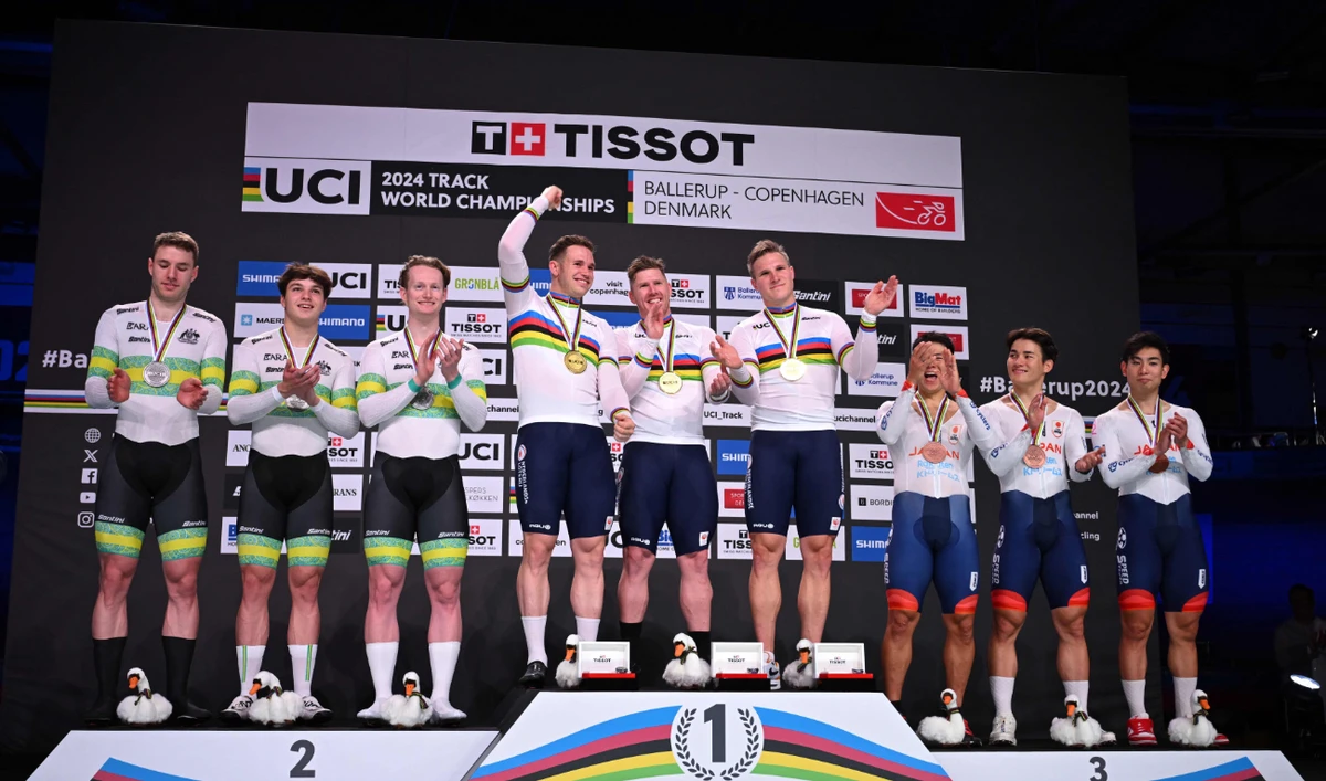 (L-R) Second place Team Australia, winner Team Netherlands and third place Team Japan celebrate on the podium after the men's team sprint final race of the UCI Track Cycling World Championships in Ballerup, Denmark, on Oct. 16, 2024. (AFP)