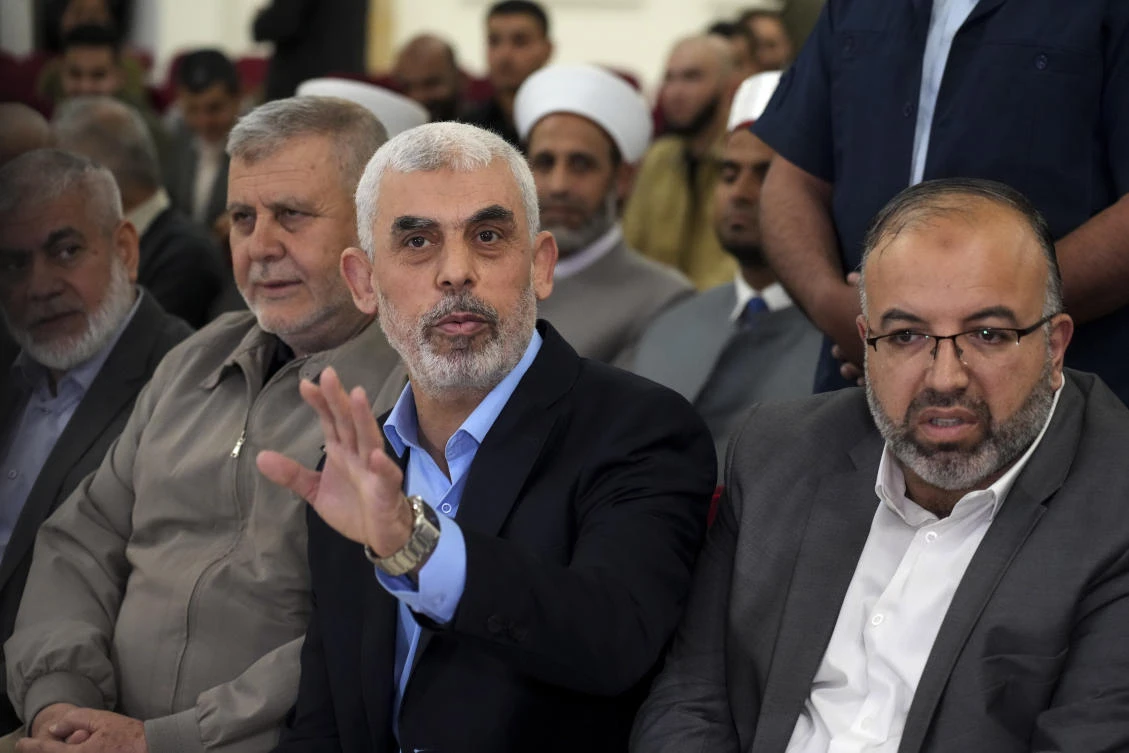 Yahya Sinwar, head of Hamas in Gaza, greets his supporters upon his arrival at a meeting on the seaside of Gaza City, on April 30, 2022. (AP/File)