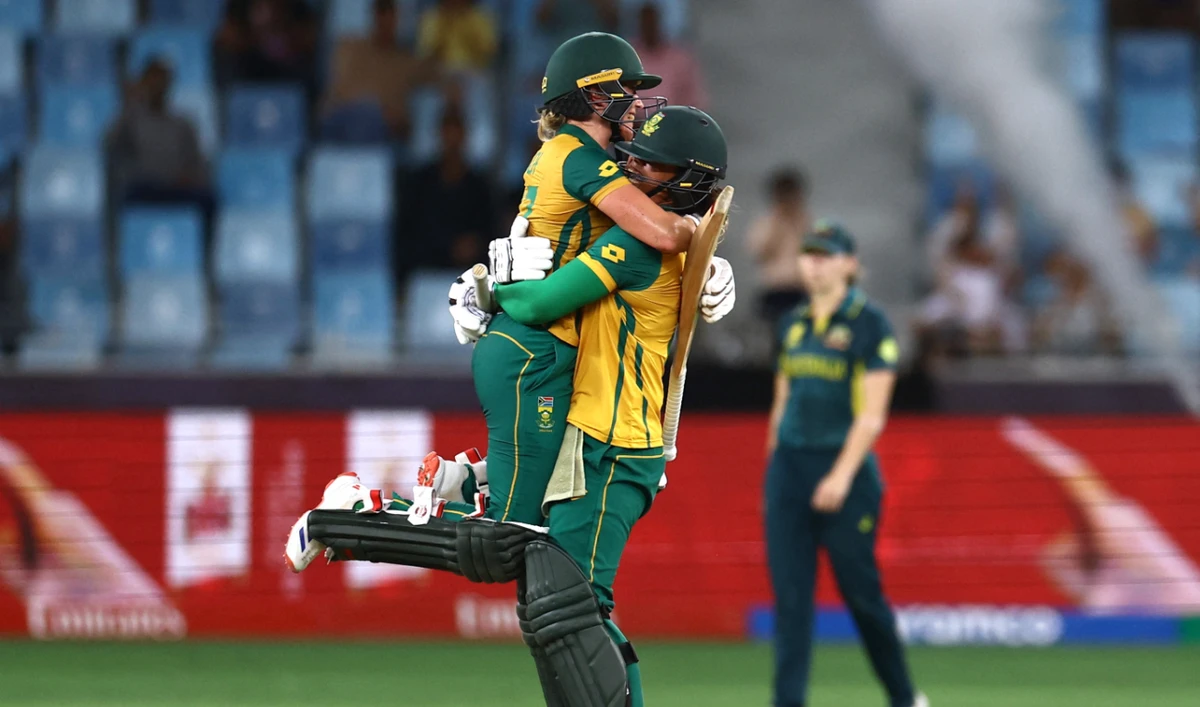 South Africa’s Anneke Bosch and Chloe Tryon celebrate after winning their Women’s Cricket T20 World Cup semifinal against Australia at Dubai International Stadium, Dubai, on Oct. 17, 2024. (Reuters)
