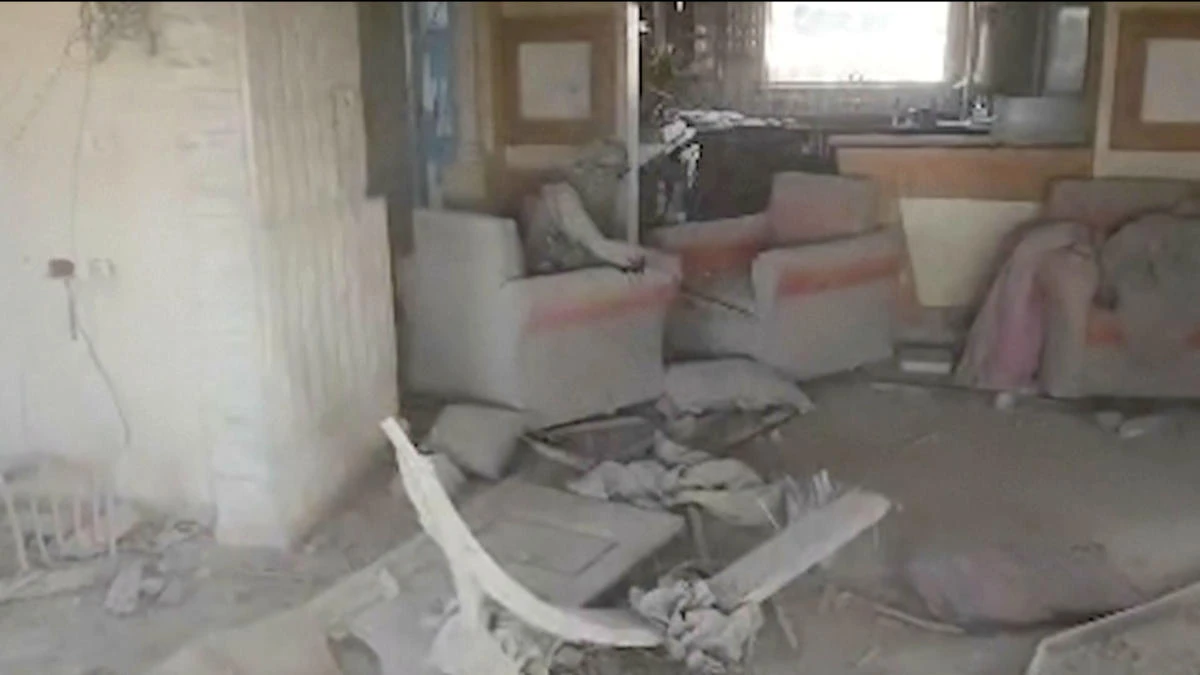 This video grab released by the Israeli military on Thursday Oct. 17, 2024, shows a destroyed building, with a person the Israeli military identified as Hamas leader Yahya Sinwar seated in chair. (AP)