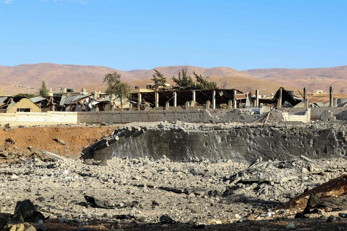 People inspect an area that was hit by an Israeli air strike on the village of Taybeh in Lebanon's eastern Bekaa Valley on October 18, 2024. (AFP)