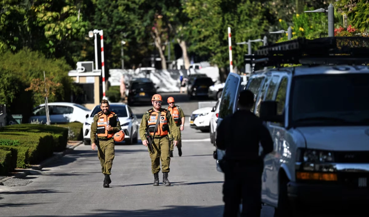 Israeli Home Front Command soldiers walk down a street in Caesarea, Israel on October 19, 2024 following a drone attack from Lebanon towards Israel amid ongoing hostilities between Hezbollah and Israel. (REUTERS)