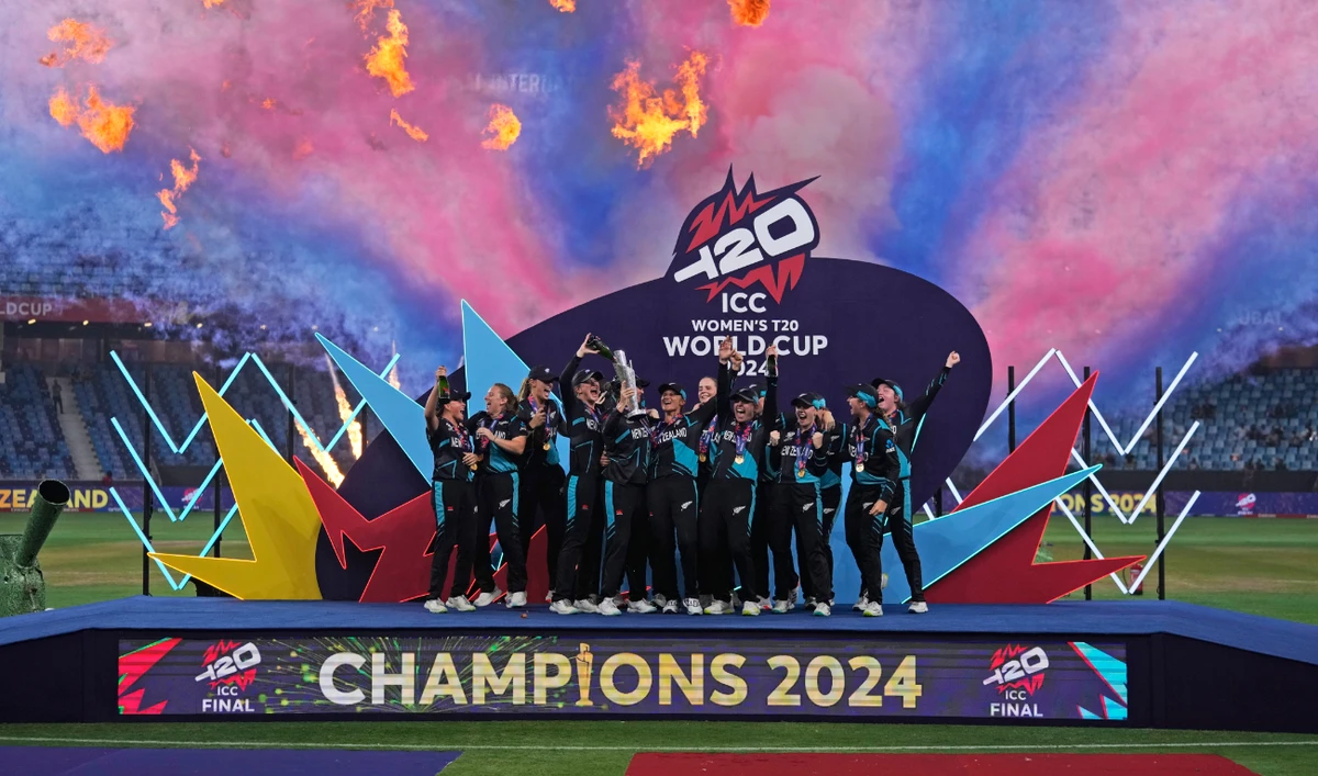 New Zealand's players celebrate with the trophy after winning the ICC Women's T20 World Cup 2024 final match against South Africa at Dubai International Cricket Stadium, UAE, Sunday. (AP)