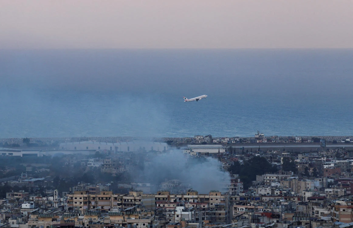A Lebanese Middle East Airlines (MEA) plane takes off from Beirut-Rafic Hariri International Airport as smoke billows in Beirut on Oct. 22, 2024. (Reuters)