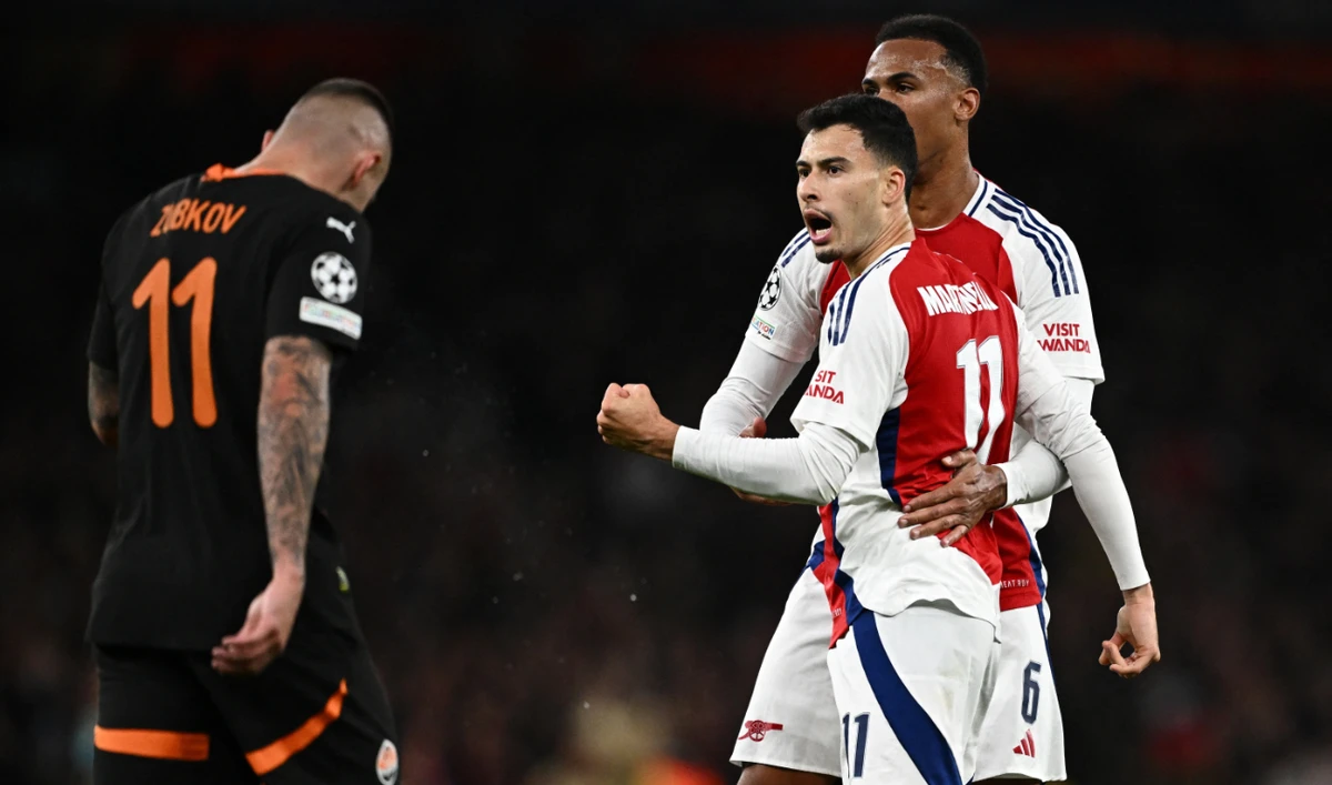 Arsenal's Gabriel Martinelli and Gabriel Magalhaes celebrate their first goal, an own goal scored by Shakhtar Donetsk's Dmytro Riznyk, during the Arsenal v Shakhtar Donetsk match at the Emirates Stadium, London, Britain on October 22, 2024 (Reuters)