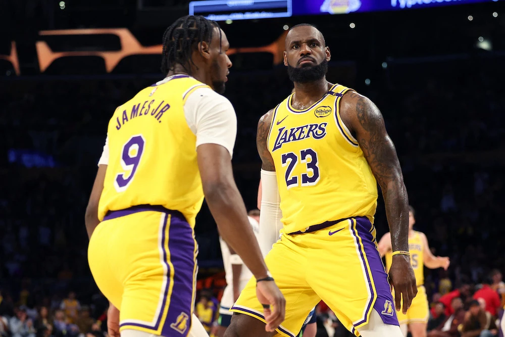 LeBron James and Bronny James of the Los Angeles Lakers react during their game against the Minnesota Timberwolves at Crypto.com Arena on Oct. 22, 2024 in Los Angeles, California. (Getty Images/AFP)