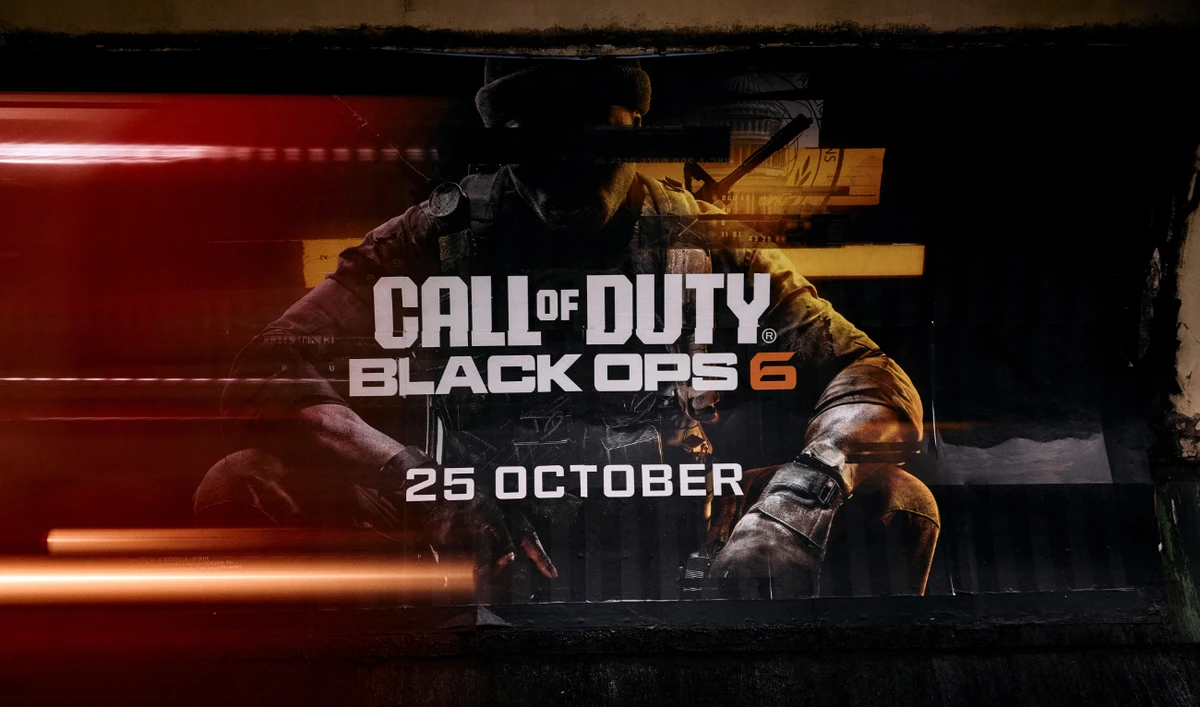 A photograph taken on October 14, 2024 show an advertisement poster displayed at a tube station, in London, for the video game "Call of Duty: Black Ops 6" by Activision, ahead of its worldwide release on October 25. (AFP)