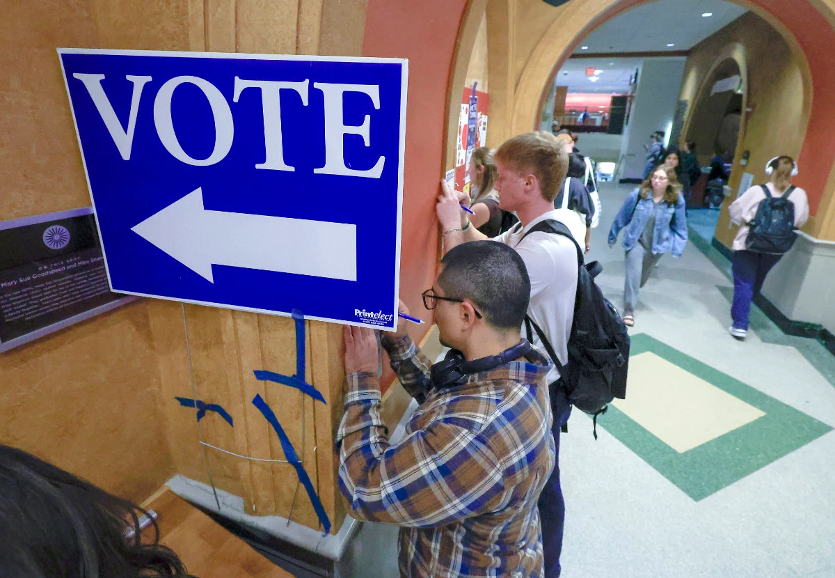 Students at The University of Wisconsin-Madison fill out ballots during the first day of Wisconsin's in-person absentee voting on the campus in Madison, Wisconsin, on Oct. 22, 2024. (Wisconsin State Journal/AP)