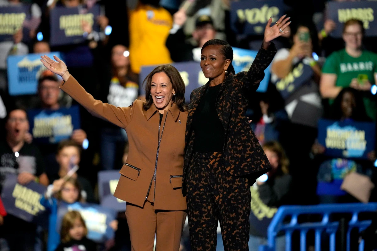 Democratic presidential nominee Vice President Kamala Harris, left, and former first lady Michelle Obama arrive to speak at a campaign rally at the Wings Event Center on Oct. 26, 2024, in Kalamazoo, Michigan. (AP)