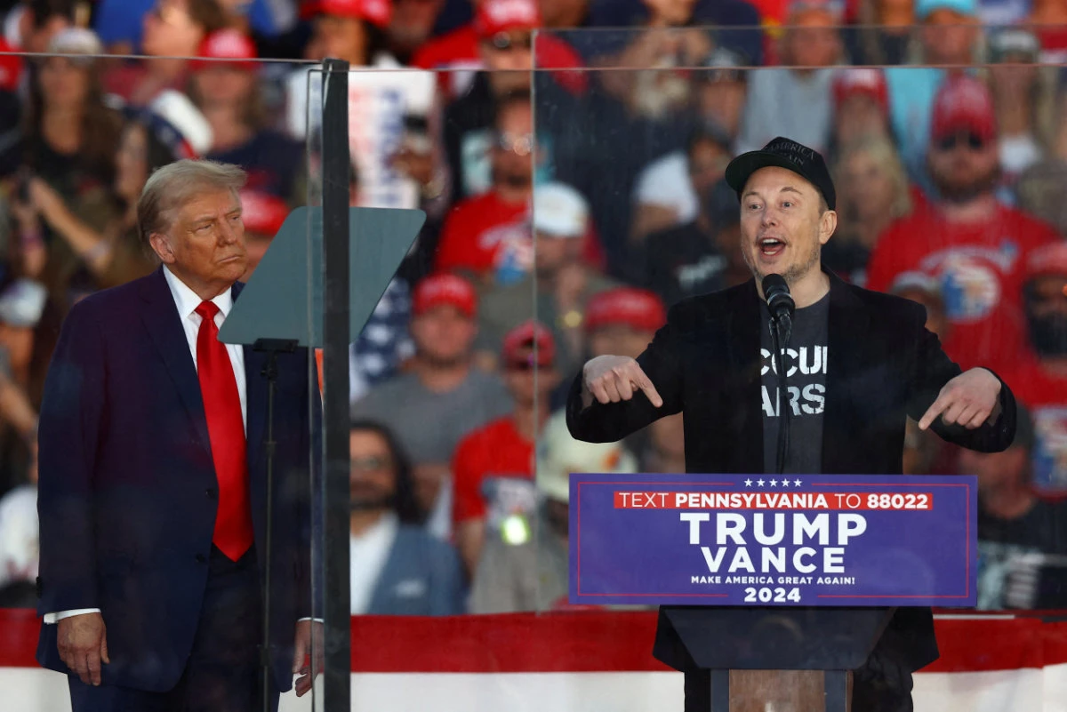 Tesla CEO and X owner Elon Musk speaks as Republican presidential nominee and former US president Donald Trump looks on during a rally in Butler, Pennsylvania, on October 5, 2024. (REUTERS/File Photo)