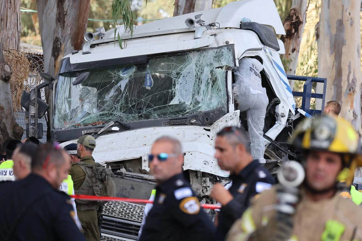 One killed, dozens injured in truck ramming at Israeli bus stop