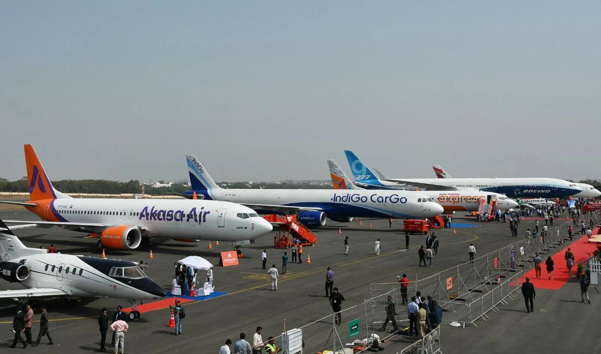 Visitors gathered near the airline aircrafts displayed during the 'Wings India 2024', an exhibition and conference on civil aviation, at the Begumpet Airport in Hyderabad on January 18, 2024. (AFP/ File)