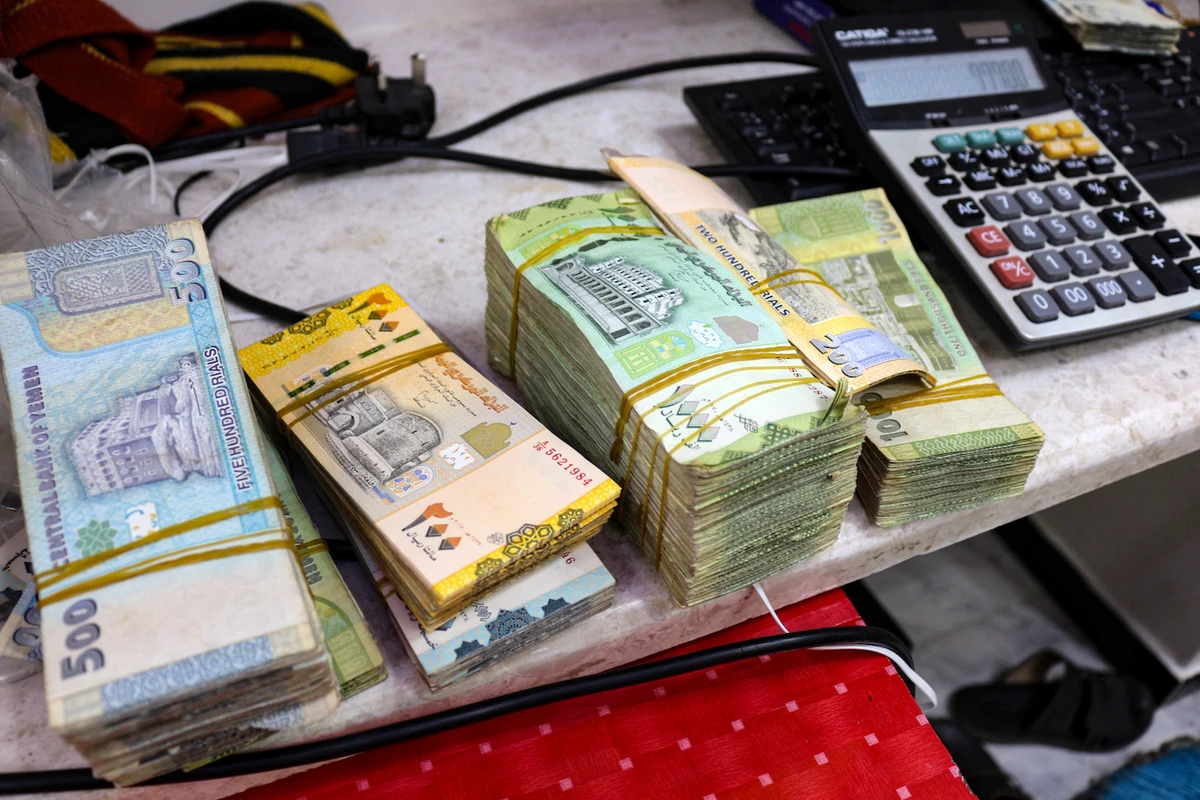 Money traders and local media said the Yemeni riyal was on track to break another record of 2,100 against the dollar on Sunday. (File/AFP)