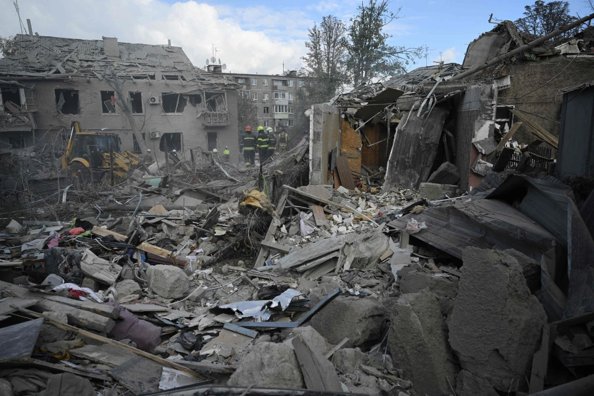 Ukrainian rescuers clear debris on the site of a Russian missile strike in the eastern city of Dnipro on Oc. 26, 2024, amid the Russian invasion of Ukraine. (AFP)