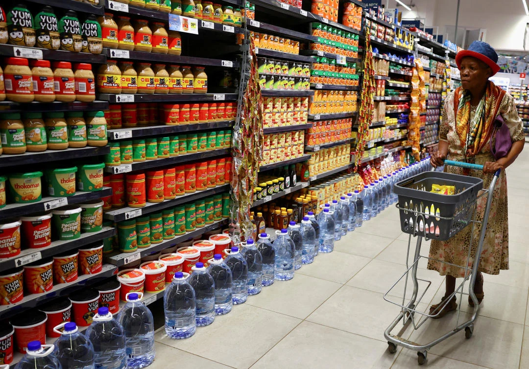 FILE PHOTO: A woman uses a trolley as she shops at a Pick n Pay store at the Dobson Point Shopping Centre, in Soweto, South Africa, March 19, 2024. (Reuters)