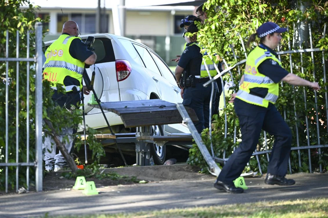 Victoria police work the scene where a car crashed through a fence into the Auburn South Primary School in Hawthorn East in Melbourne, Australia, Tuesday, Oct. 29, 2024. (AP)