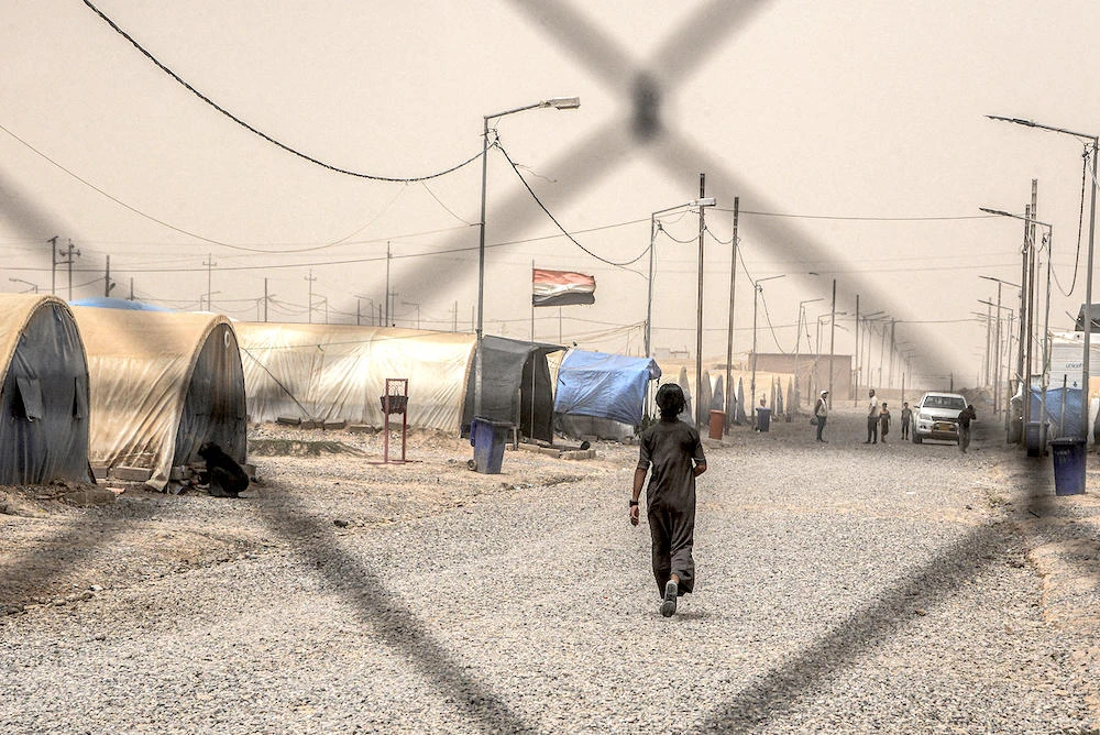 A human rights group claimed documented cases of ‘torture and ill-treatment’ among Iraqis who returned home from Syria to Al-Jadaa camp in northern Iraq. (AFP file photo)