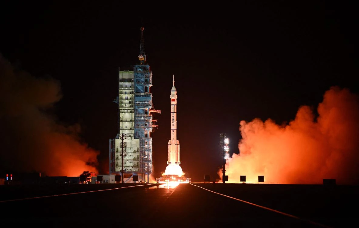 A long March-2F carrier rocket carrying the Shenzhou-19 spacecraft and crew of three astronauts lifts off from the Jiuquan Satellite Launch Center, in the Gobi desert, northwest China. (AFP)