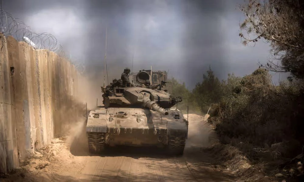An Israeli tank enters Lebanon, from northern Israel, at the Naqoura border point, Oct. 13, 2024. (AFP)
