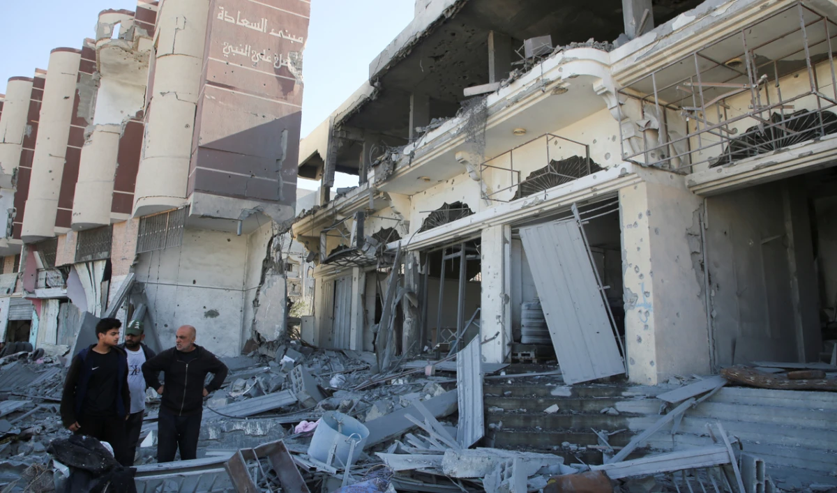 Palestinians inspect the site of an Israeli strike on a house in Khan Younis in the southern Gaza Strip on October 30, 2024. (Reuters)