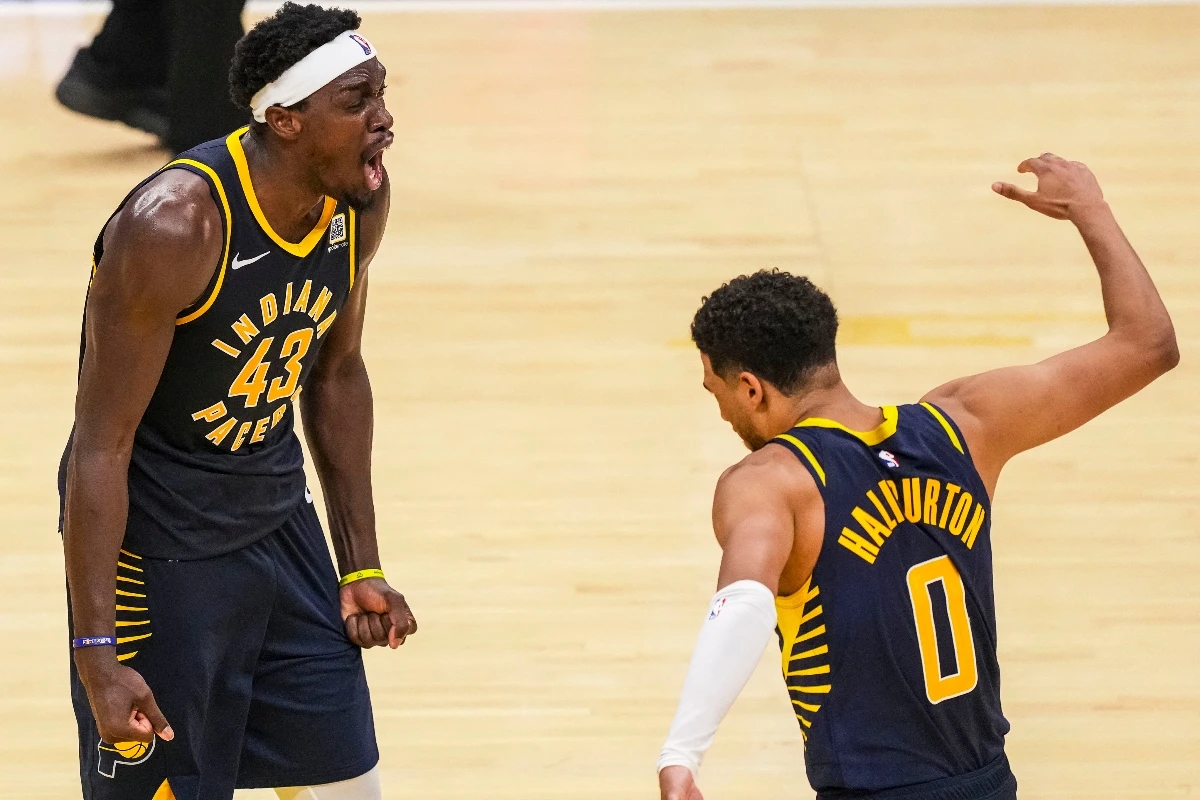 Indiana Pacers forward Pascal Siakam (43) and guard Tyrese Haliburton celebrate Siakam's game-winning three point basket against the Boston Celtics at Gainbridge Fieldhouse Wednesday. (USA TODAY Sports)