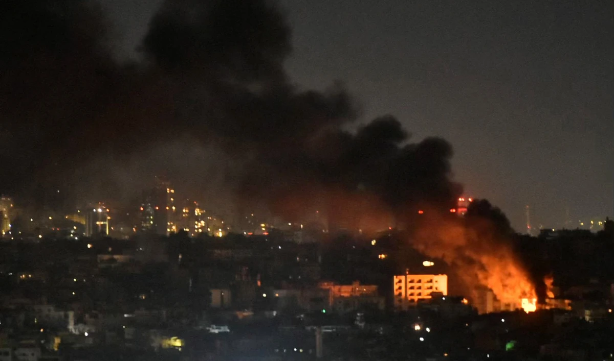 Smoke and flames rise from areas targeted by an Israeli airstrike in Beirut’s southern suburbs late on October 20, 2024. (AFP)