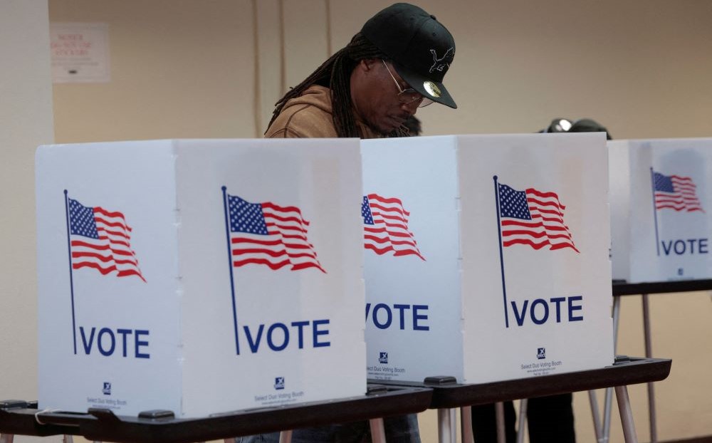 A person votes during early voting in the US presidential election at a polling station in Detroit, Nov. 3, 2024. (Reuters)