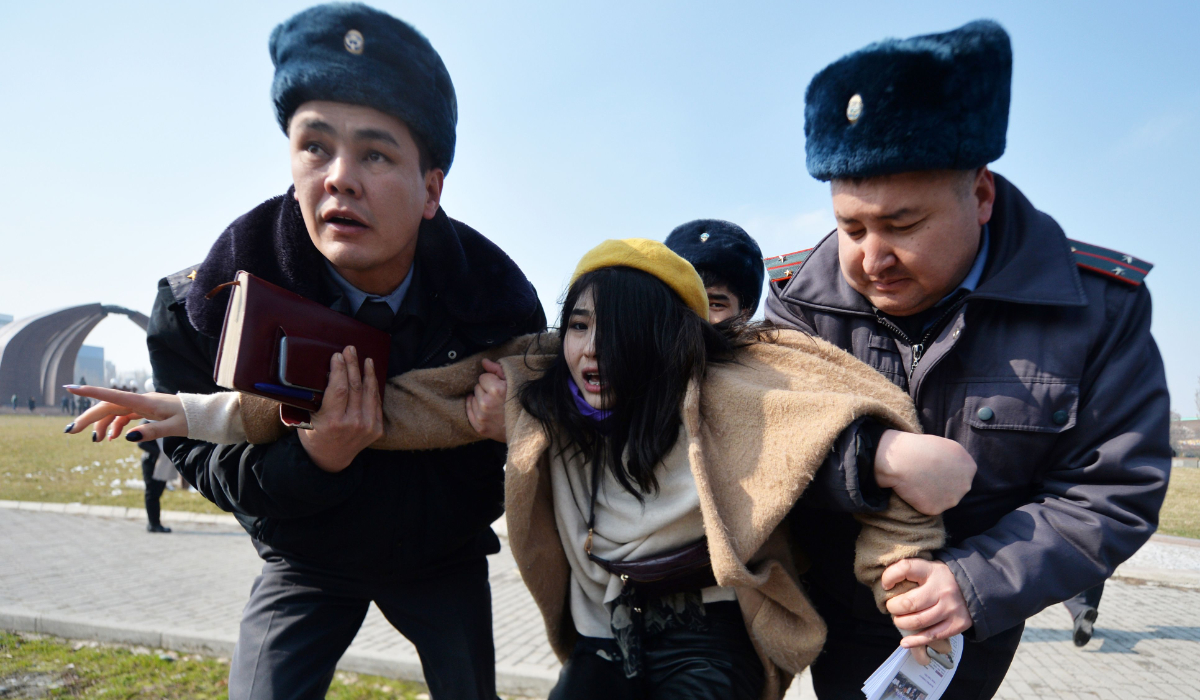 Kyrgyz police arrest a woman protesting against gender-based violence to mark International Women's Day in Bishkek. (AFP file)