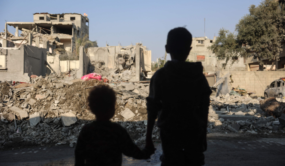 Children stare at the destruction following an Israeli strike in the Nuseirat refugee camp in Gaza on November 7, 2024. (AFP)